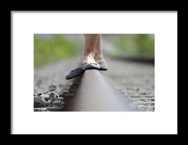 Shoes Framed Print featuring the photograph Balance on railroad tracks #1 by Mats Silvan