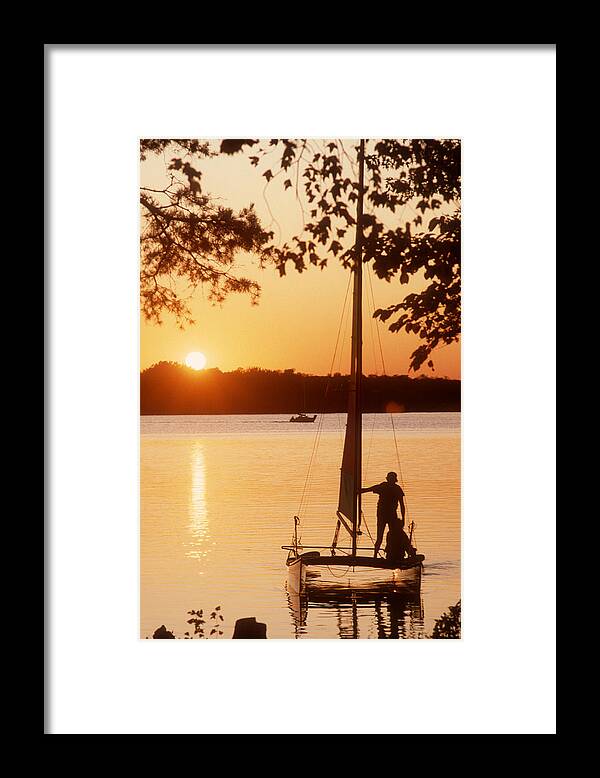 Sail Boat Framed Print featuring the photograph Setting Sail at Sunset #1 by Wanda Brandon