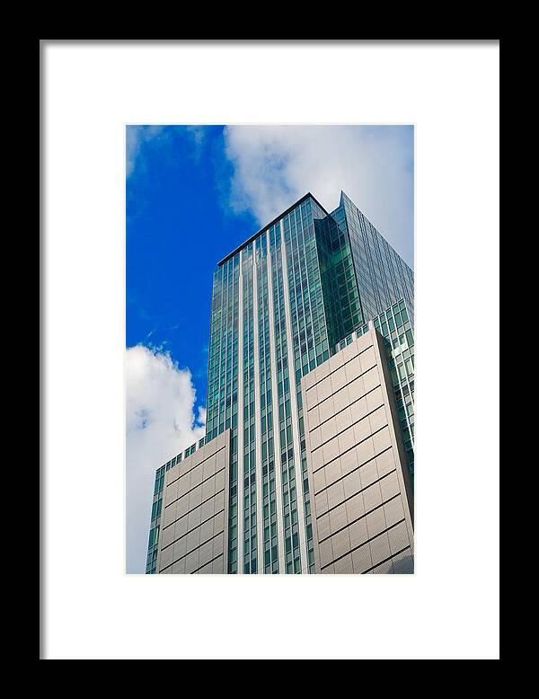 Abstract Framed Print featuring the photograph Skyscraper front view with blue sky #1 by U Schade