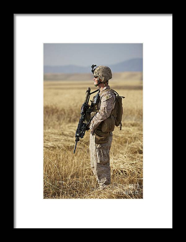 Ballistic Armor Framed Print featuring the photograph U.s. Marine Patrols A Wadi Near Kunduz #8 by Terry Moore