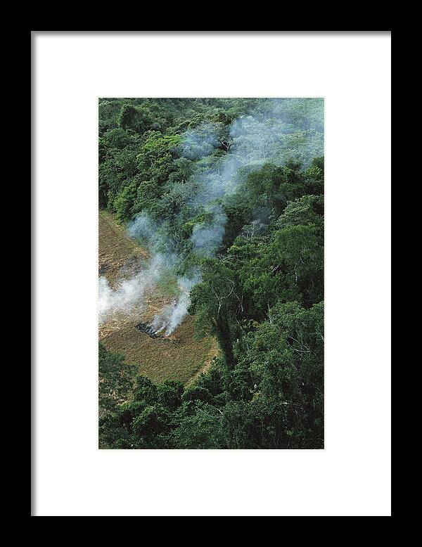 00750589 Framed Print featuring the photograph A Farmer Burns His Agricultural Field by Mark Moffett