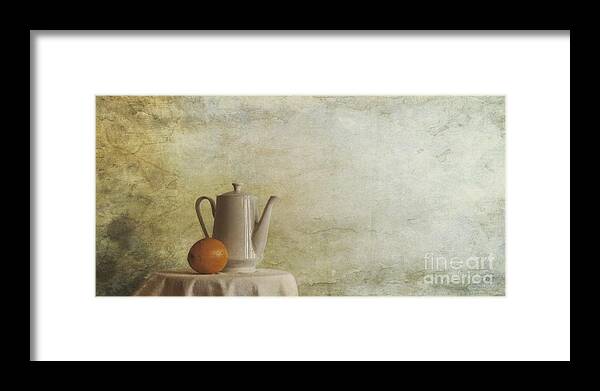 Table Framed Print featuring the photograph A Jugful Tea And A Orange by Priska Wettstein