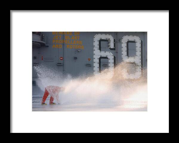 Horizontal Framed Print featuring the photograph A Sailor Collects Samples Of Aqueous by Stocktrek Images