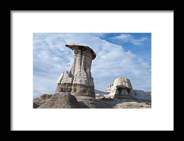Hoodoos Framed Print featuring the photograph Capped Hoodoo And Clouds by David Kleinsasser