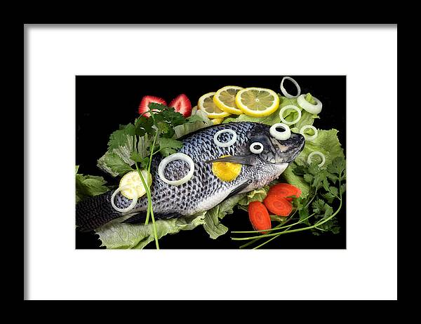 Fish Framed Print featuring the photograph Crucian fish with vegetable by Paul Ge