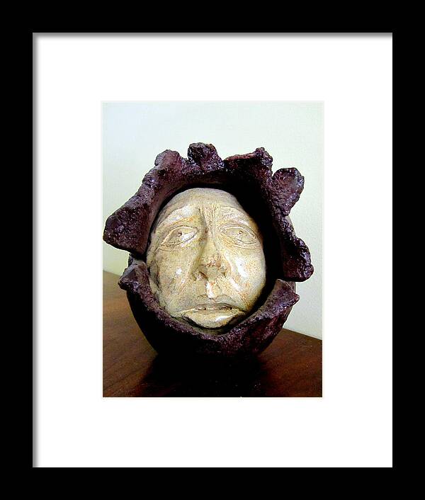 Emerging Framed Print featuring the sculpture Emerging white pale face born out of a brown purple thing eyes nose mouth by Rachel Hershkovitz