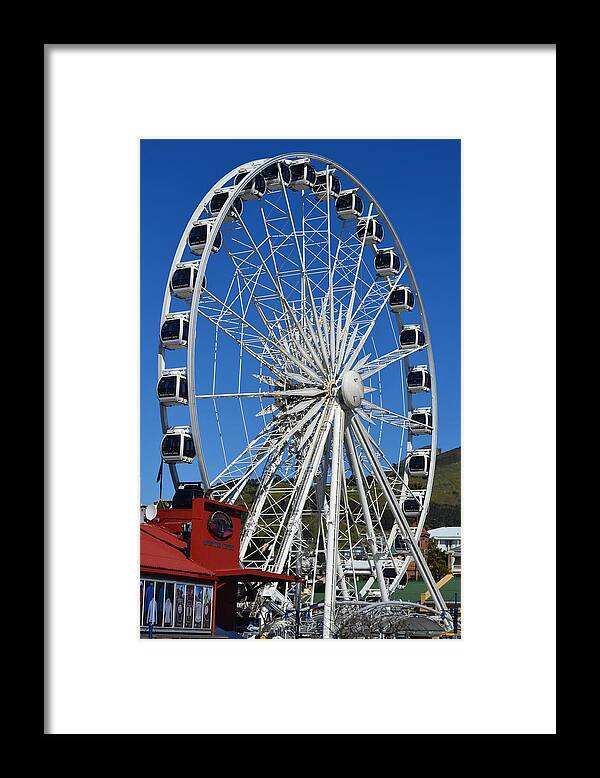 Ferris Wheel; V&a Waterfront; Cape Town; South Africa; Western Cape; Harbor; Blue; White; Steel; Round; Cabins; High; Tall; Big; Attraction; Populair; Background; Framed Print featuring the photograph Ferris Wheel by Werner Lehmann