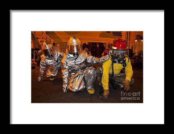 Crouching Framed Print featuring the photograph Firemen Brace For Shock by Stocktrek Images