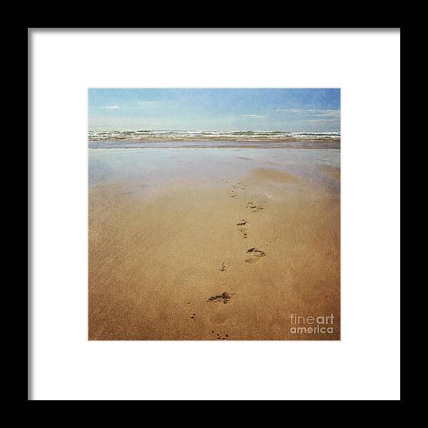 Footprints Framed Print featuring the photograph Footprints in the sand by Lyn Randle