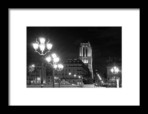 Notre Framed Print featuring the photograph Foreshortening of Paris by night by Fabrizio Ruggeri