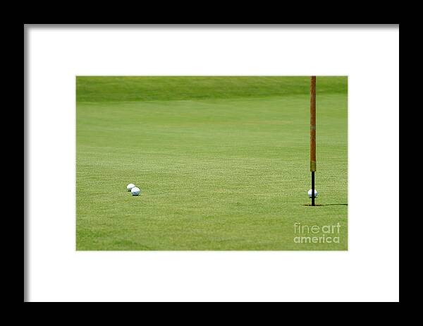 Almost Framed Print featuring the photograph Golf balls near flagstick by Henrik Lehnerer