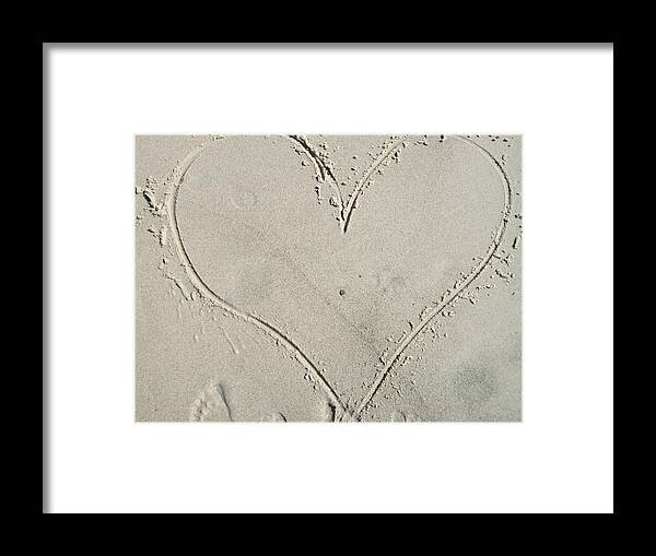 Heart In The Sand Footprints In Sand Beach Framed Print featuring the photograph It's Yours by Amy Jenkins