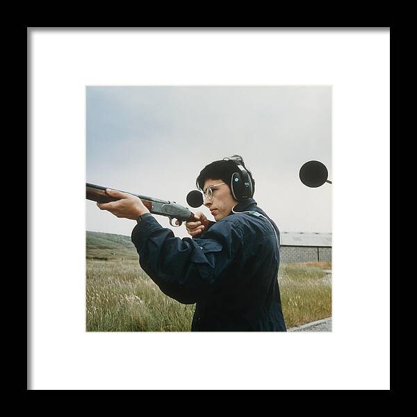 Hearing Protectors Framed Print featuring the photograph Man Tests The Effectiveness Of Hearing Protectors by Crown Copyrighthealth & Safety Laboratory