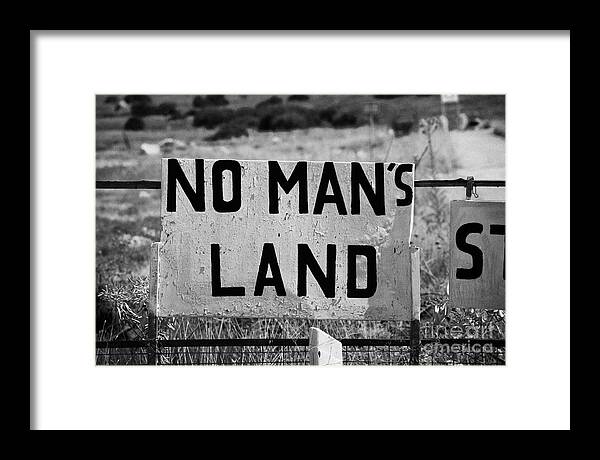 United Framed Print featuring the photograph no mans land and restricted area of the UN buffer zone in the green line dividing cyprus famagusta by Joe Fox