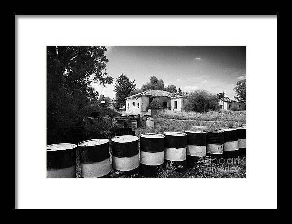 United Framed Print featuring the photograph no mans land and restricted area of the UN buffer zone in the green line dividing north south cyprus by Joe Fox