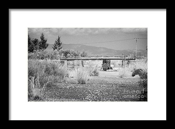 United Framed Print featuring the photograph old abandoned road to nicosia in the UN buffer zone in the green line dividing north south cyprus by Joe Fox