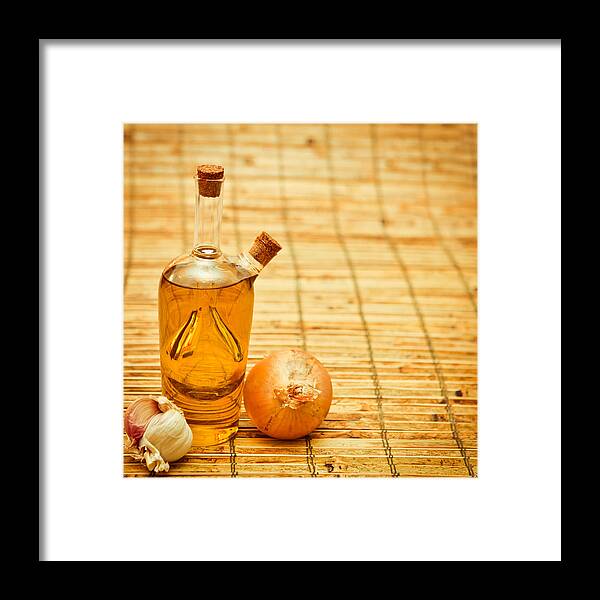 Bulb Framed Print featuring the photograph Olive oil by Tom Gowanlock