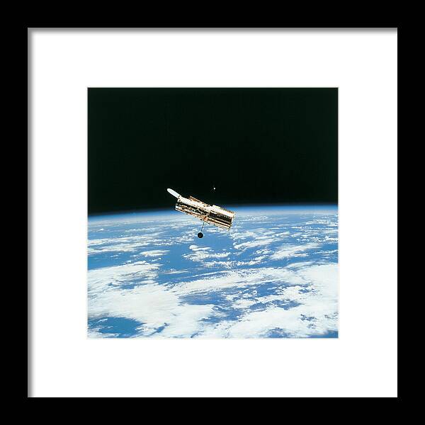 Square Framed Print featuring the photograph Satellite In Orbit Above Earth by Stockbyte