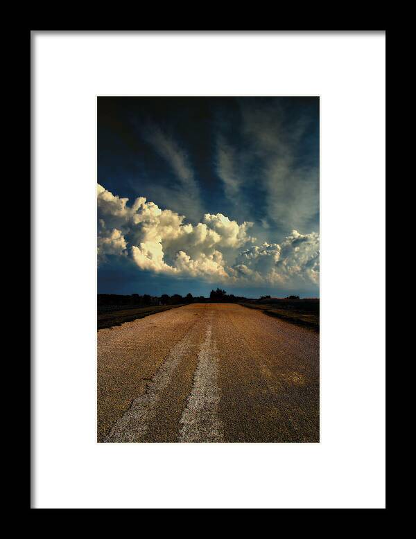 White Clouds Framed Print featuring the photograph Something Wicked Ahead by Bill and Linda Tiepelman
