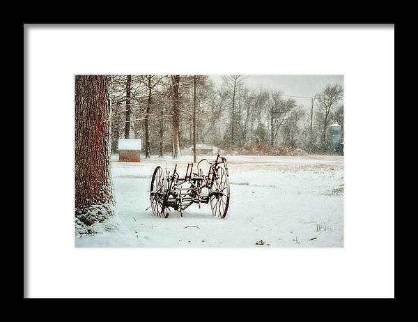 Snow Framed Print featuring the photograph The Broken Wheel by Kelly Reber