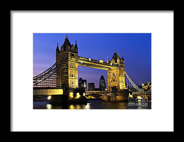 Tower Framed Print featuring the photograph Tower bridge in London at night by Elena Elisseeva