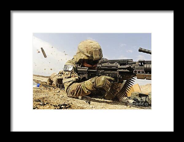 Security Forces Framed Print featuring the photograph U.s. Air Force Soldier Fires The Mk48 by Stocktrek Images