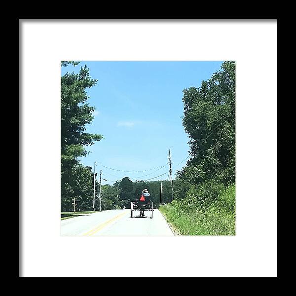 Amish Framed Print featuring the photograph An Amish wagon climbing the hill by Kimberly W