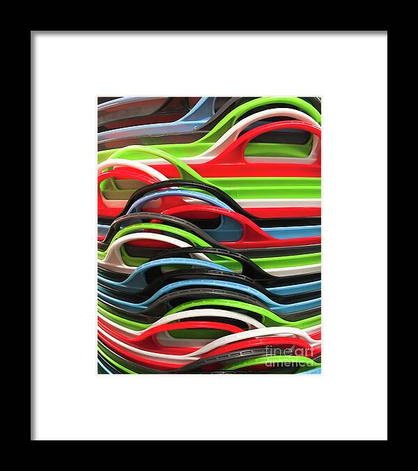 Abstract Framed Print featuring the photograph Colourful plastic containers #1 by Tom Gowanlock