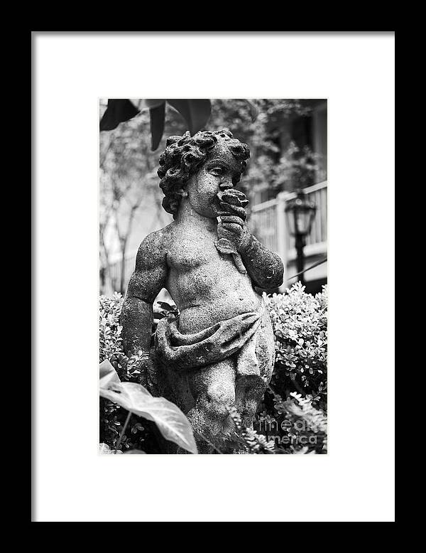 Angel Framed Print featuring the photograph Courtyard Statue of a Cherub French Quarter New Orleans Black and White #1 by Shawn O'Brien