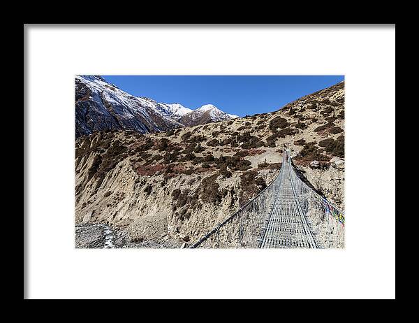 Annapurna Circuit Framed Print featuring the photograph Suspension bridge along the Annapurna circuit trek #1 by Didier Marti