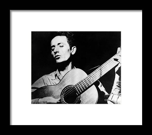 1950s Framed Print featuring the photograph Woody Guthrie by Granger