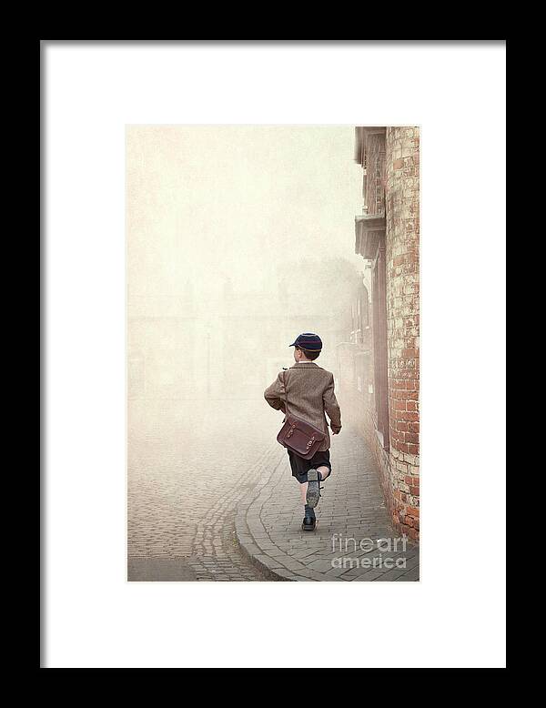 Boy Framed Print featuring the photograph 1940s Schoolboy Running Down A Terraced Street by Lee Avison