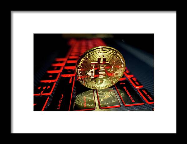 Keyboard Framed Print featuring the photograph Bitcoin coin l on laptop keyboard #2 by Alex Grichenko