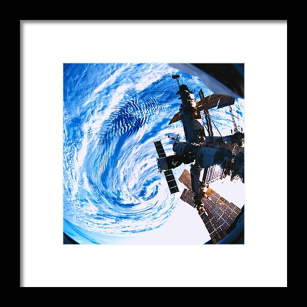 Square Framed Print featuring the photograph A Space Station Orbiting Above Earth #3 by Stockbyte