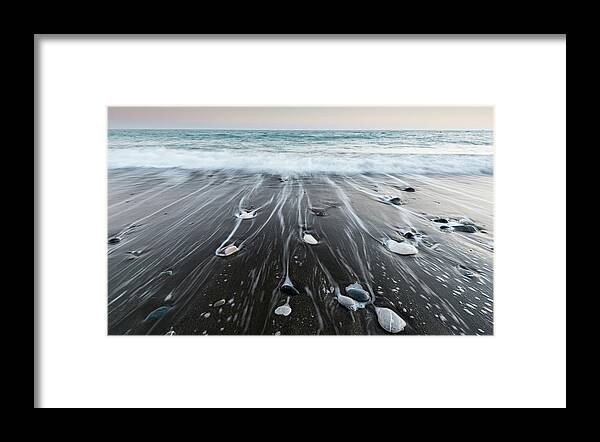 Seascape Framed Print featuring the photograph Pebbles in the beach and flowing sea water by Michalakis Ppalis