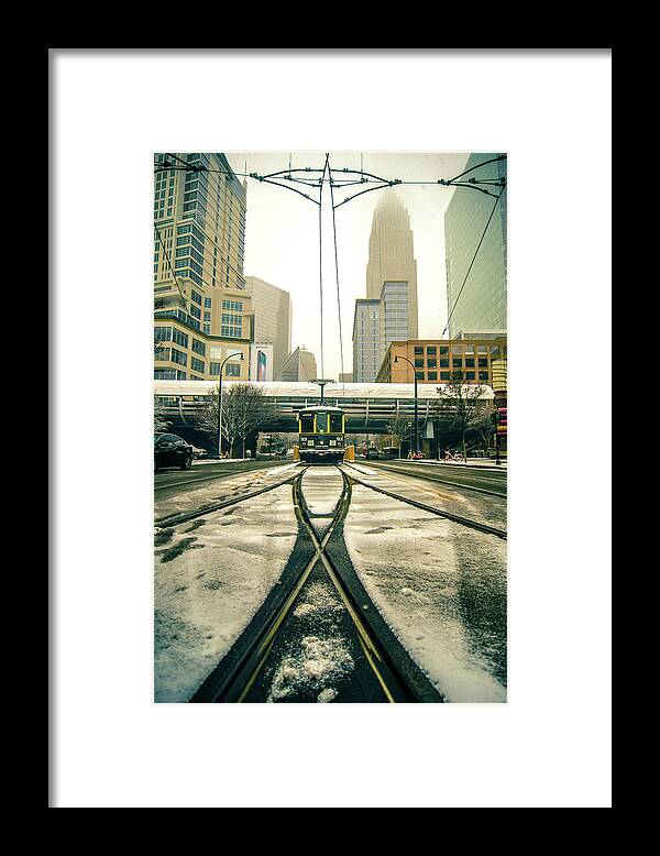 Streetcar Framed Print featuring the photograph Streetcar Waiting For Passengers In Snowstrom In Uptown Charlott #3 by Alex Grichenko