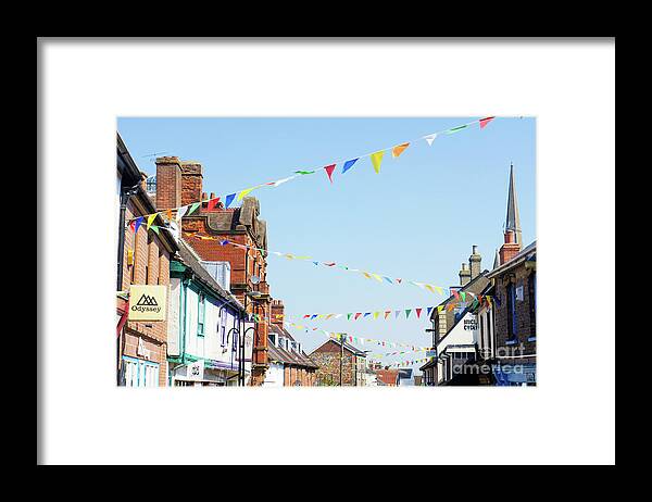 Architecture Framed Print featuring the photograph Street bunting flags #5 by Tom Gowanlock