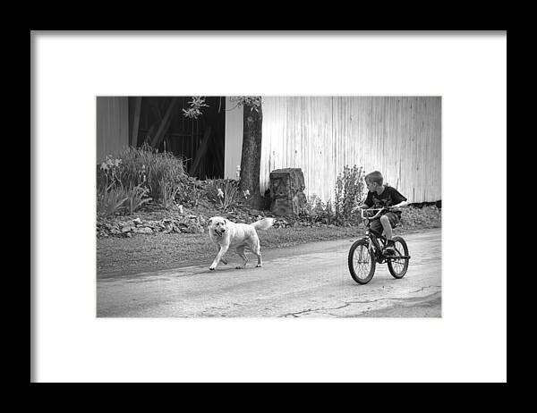 A Boy And His Dog Bw Framed Print featuring the photograph A Boy and His Dog BW by Phyllis Taylor