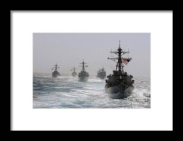 Horizontal Framed Print featuring the photograph A Fleet Of Ships In Formation At Sea by Stocktrek Images