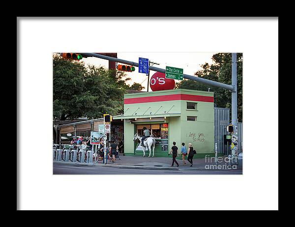 Man Framed Print featuring the photograph A man on horseback stops at a South Congress coffee stand for a cappuccino by Dan Herron