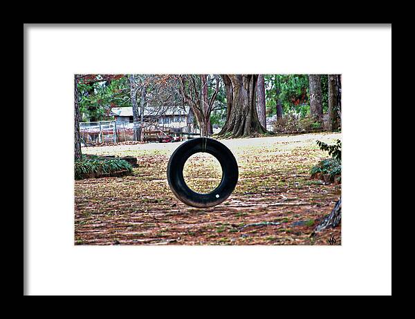 Tire Swing Framed Print featuring the photograph A Tire Swing by Gina O'Brien