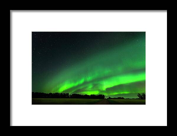 Aurora Borealis Framed Print featuring the photograph A Tsunami of Green by Dan Jurak