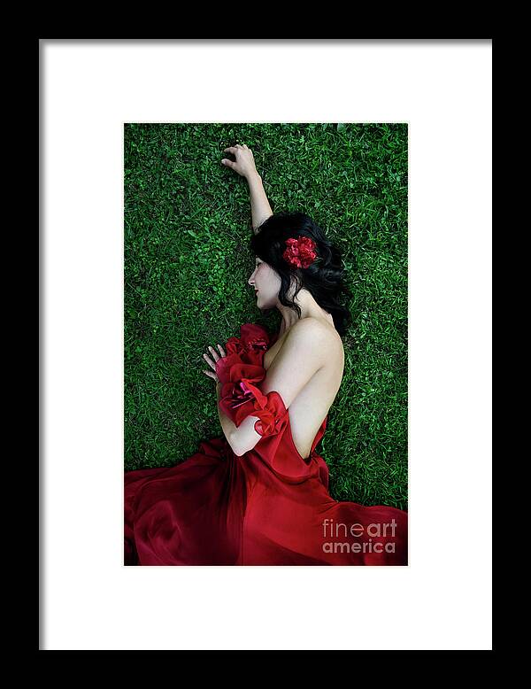 Woman Framed Print featuring the photograph A woman sleeping on the grass in a red dress by Jelena Jovanovic