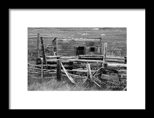 Black White Monochrome Abandoned Farm Outbuilding Fence Wood Abandon Decrepit Old West Prairie Framed Print featuring the photograph Abandoned Farm 7728 by Ken DePue