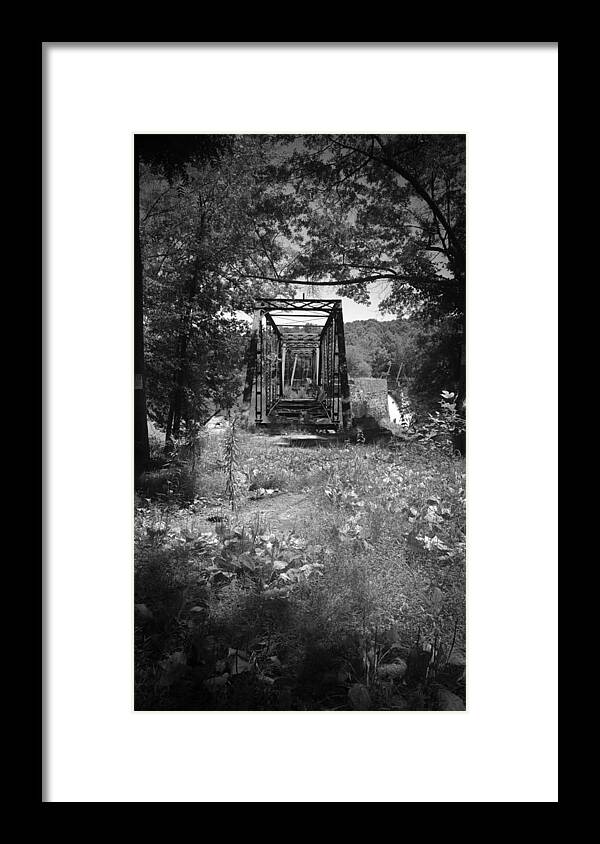 Kelly Hazel Framed Print featuring the photograph Abandoned Rail Road Trestle Bridge in Black and White by Kelly Hazel