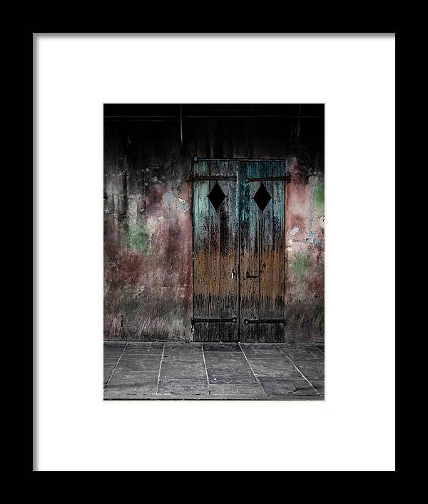 Door Framed Print featuring the photograph Aged and erie door by Jeff Kurtz