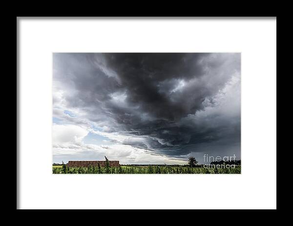 Clouds Framed Print featuring the photograph Amazing storm clouds over rural England by Simon Bratt
