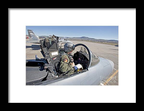 Cockpit Framed Print featuring the photograph An F-15 Pilot Performs Preflight Checks by HIGH-G Productions