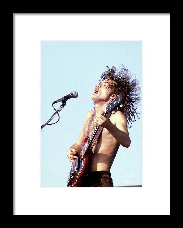 Angus Young Framed Print featuring the photograph Angus Young AC/DC 1980 by Chris Walter