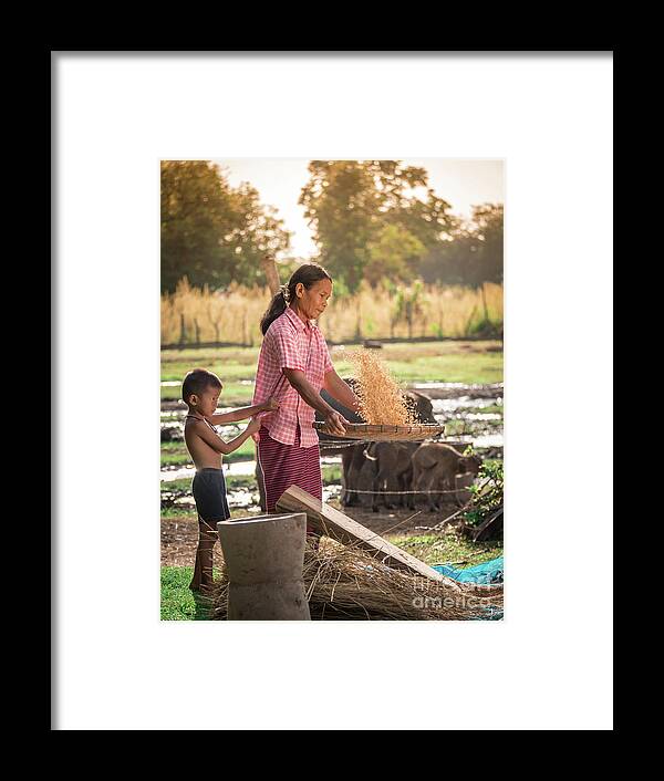 Agriculture Framed Print featuring the photograph Asian women winnow rice rice separate between rice and rice chaf by Tosporn Preede